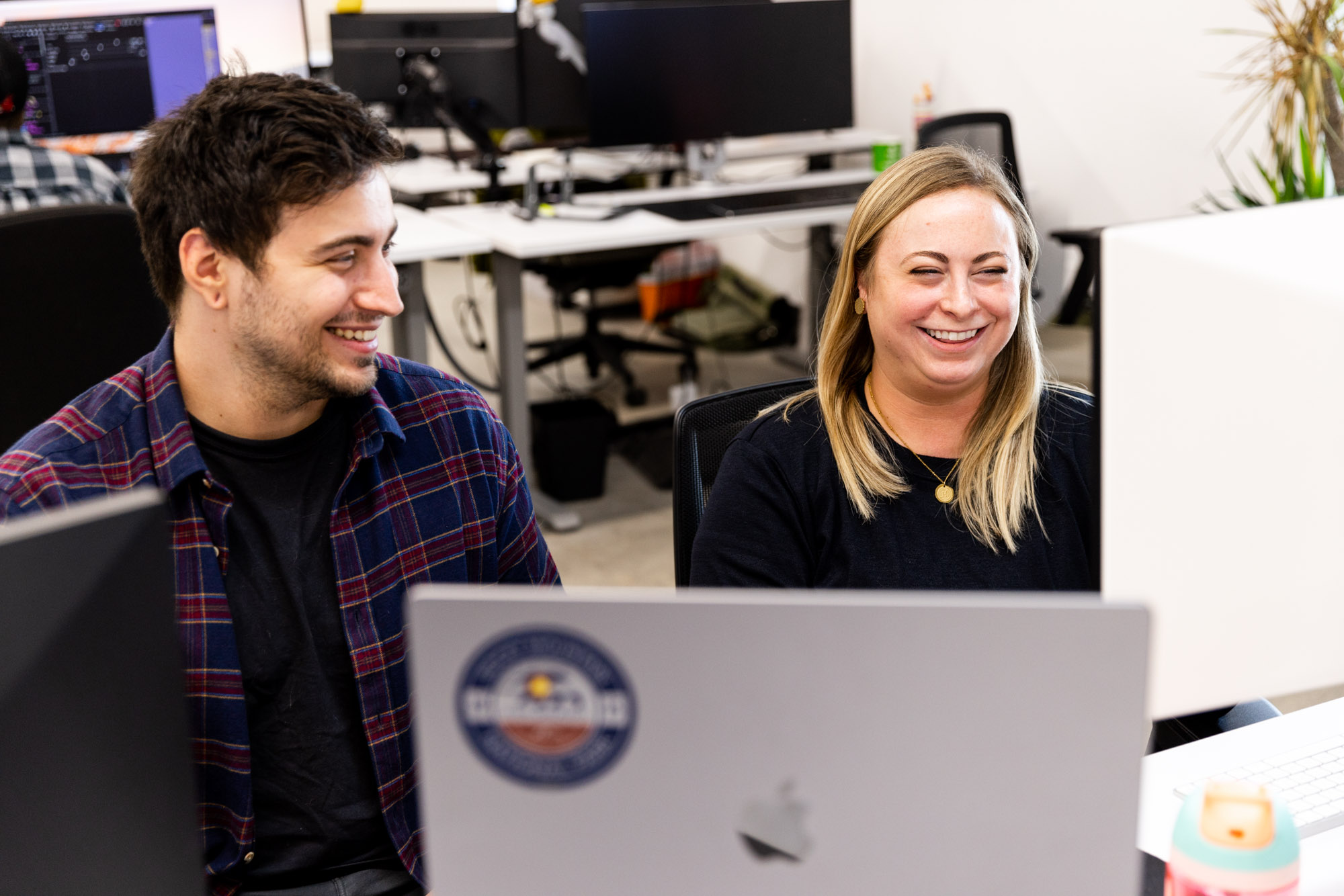 Graphic design team members collaborating on a custom logo design in Kansas City.