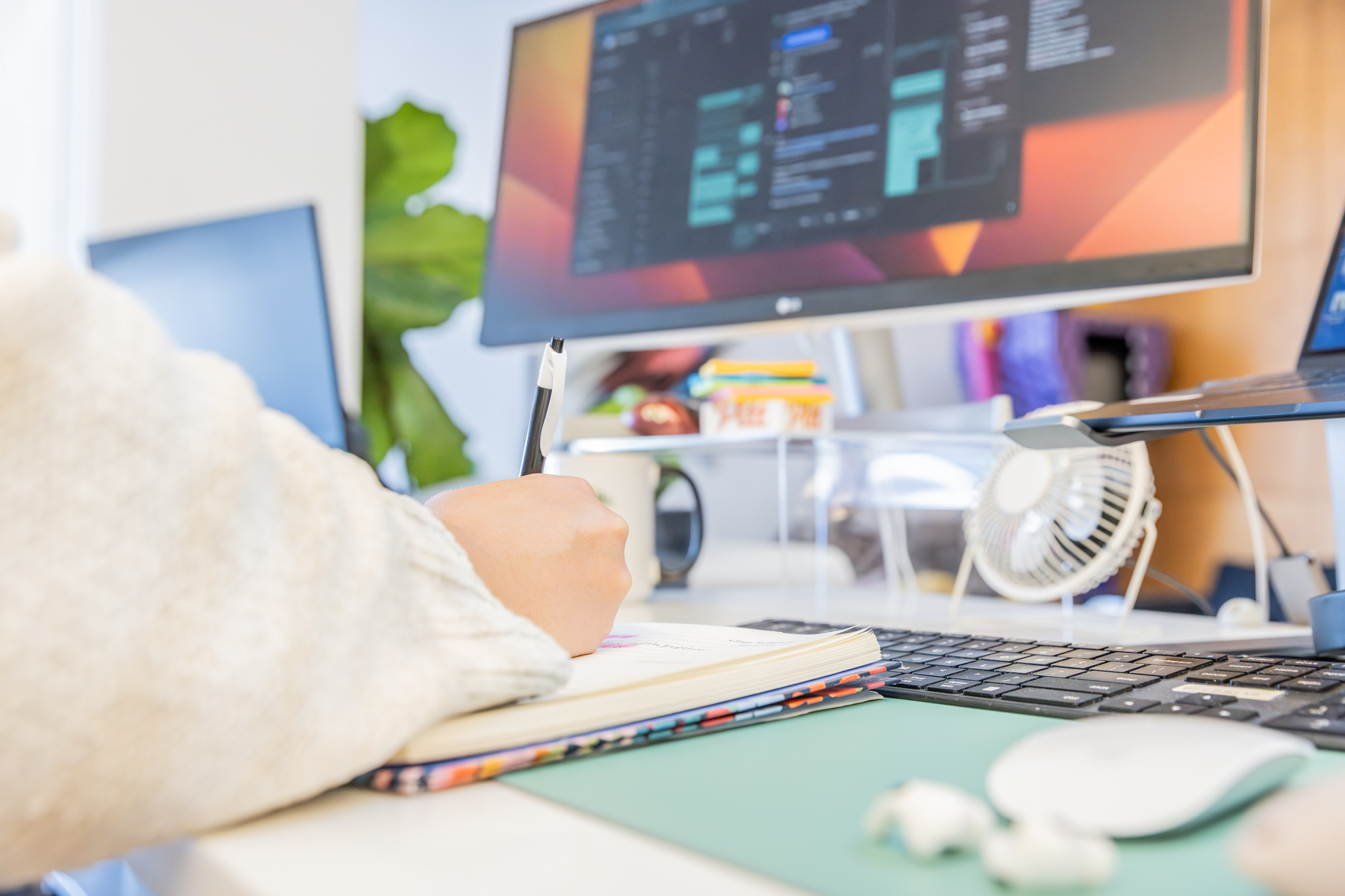 A marketing specialist takes notes at a computer about how to market your architecture firm