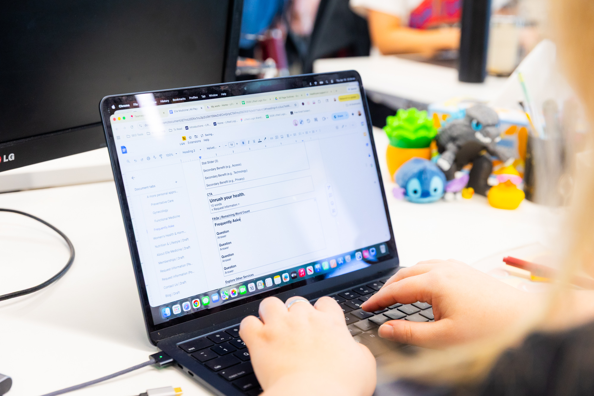 A Lifted Logic writer adds strategic headings and body copy to a client's SEO content in Kansas City.